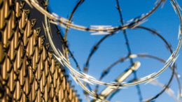 Barbed wire with blue sky background