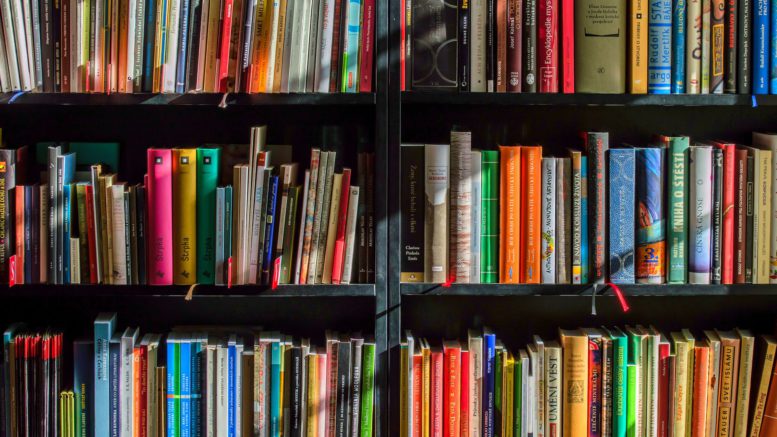 books in black wooden book shelf