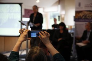 Audience member takes a photo of Claudia Beamish MSP as she chairs the Futures Forum event on Our Food Future. Pic - Fiona MacLellan