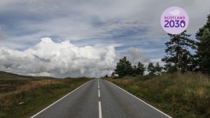 Photo of road leading away into distance in Scottish Highlands