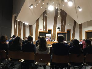 Photo of event with people sitting around a committee room table in the Scottish Parliament