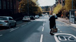 Woman crossing the road in Glasgow