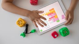 Child playing with tablet computer