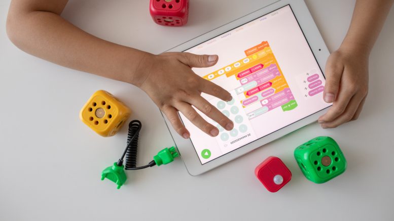 Child playing with tablet computer