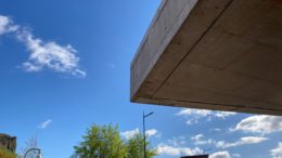 View of blue sky with part of Scottish Parliament building