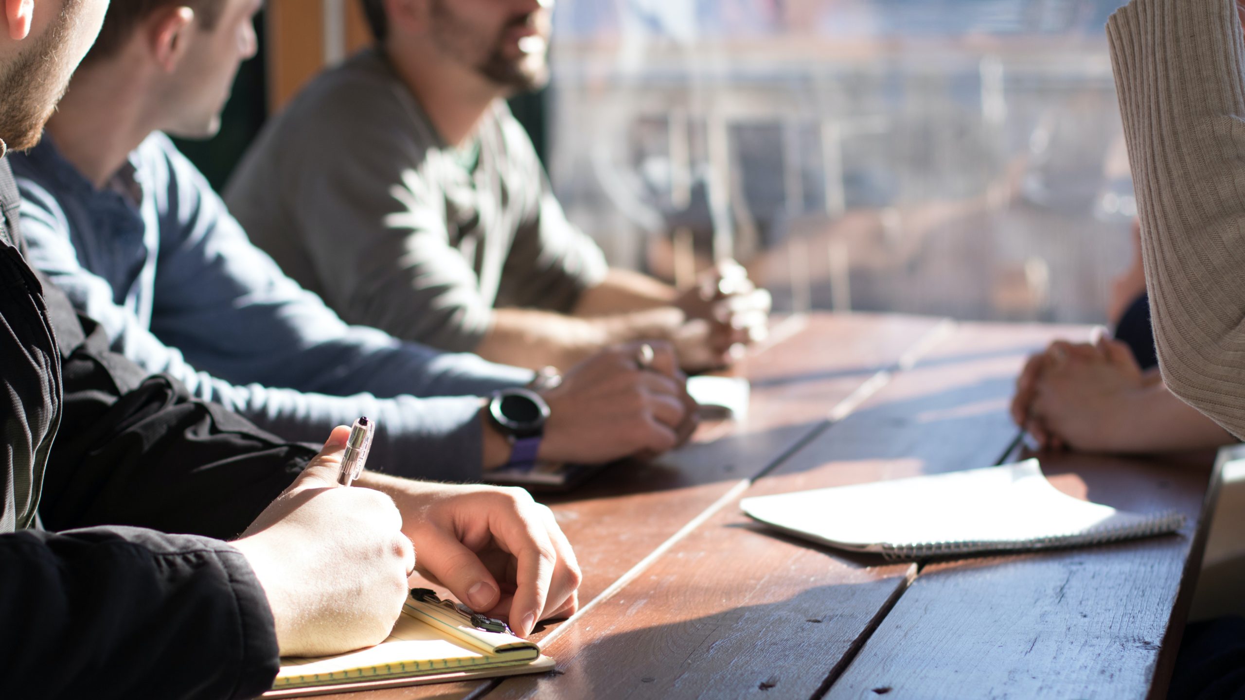 Close up of people working together at a table