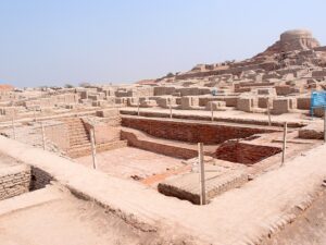 Excavated ruins of Mohenjo-daro, with the Great Bath in the foreground and the granary mound in the background.