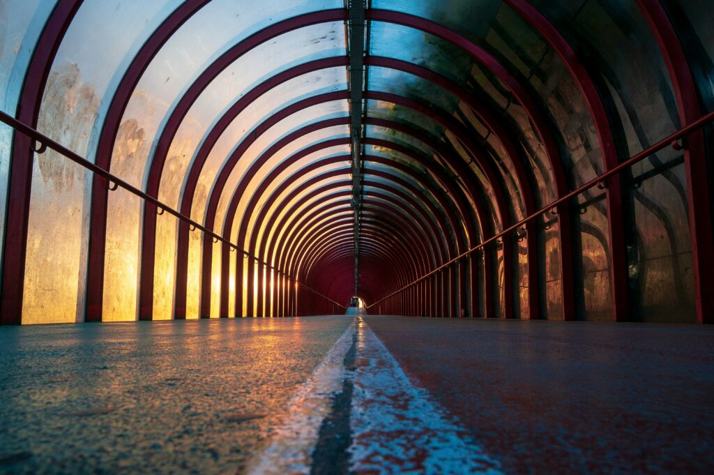 Photo of a long pedestrian tunnel in Glasgow at night